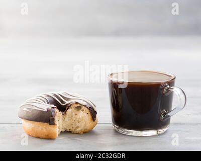 donuts and coffee on gray wooden background , copy space Stock Photo