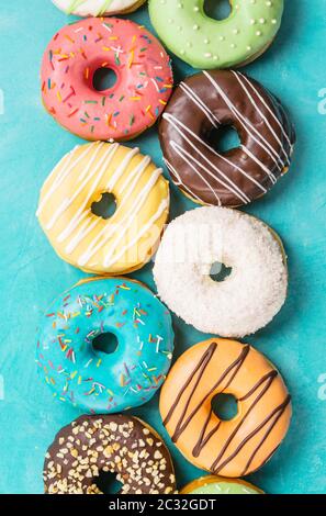 donuts on blue background, top view Stock Photo