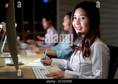 Call Center working at night. Stock Photo