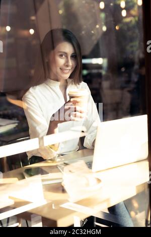 Freelancer woking at cafe Stock Photo
