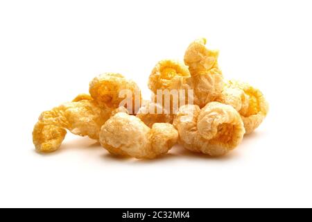 Pork snack crispy and blistered isolated on white background. Crispy pork skin pieces. Food concept. Stock Photo