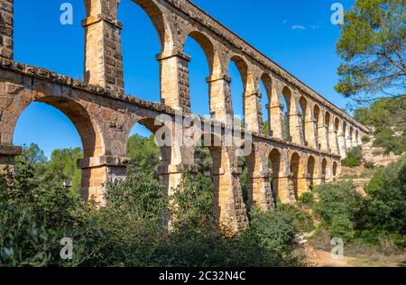 Ancient roman aqueduct Ponte del Diable or Devil's Bridge in Tarragona, Spain. Stock Photo