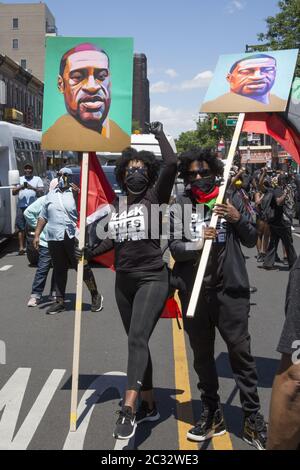 Marchers in the Flatbush neighborhood, predominantly African American, Caribbean & Haitian American, head towards Grand Army Plaza on the 18th day of demonstrations since the murder of George Floyd in Brooklyn, NY. Stock Photo