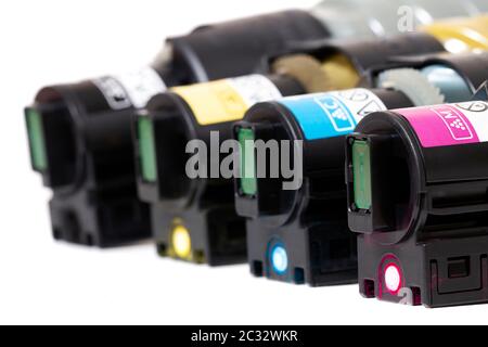 cartridges for laser printers aligned on a white background. Stock Photo