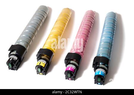 cartridges for laser printers aligned on a white background. Stock Photo