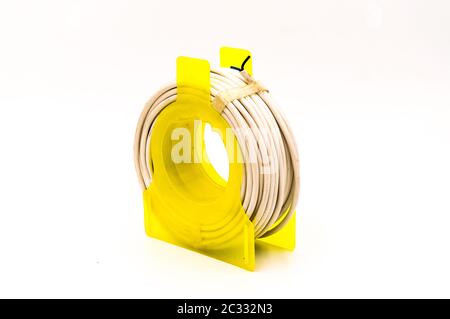 Small cable reel drum isolated on an isolated white background Stock Photo