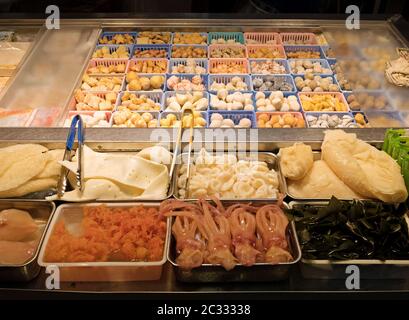 Frozen Food in Bulk Baskets at Market Stall Stock Photo