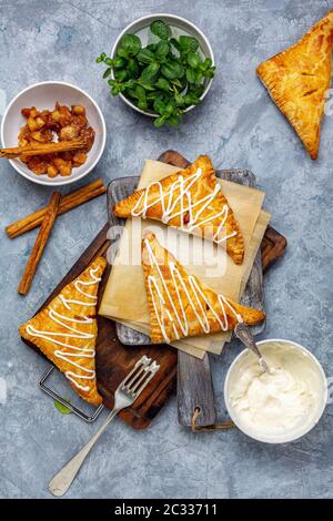 Apple turnovers with cottage cheese cream. Stock Photo