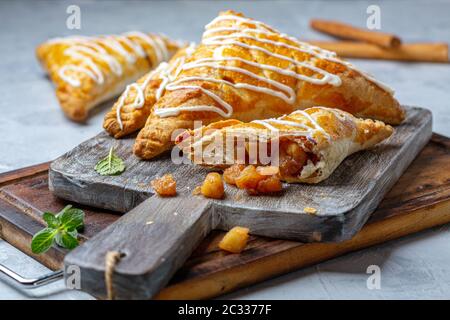 Puff pastry turns with apple filling. Stock Photo