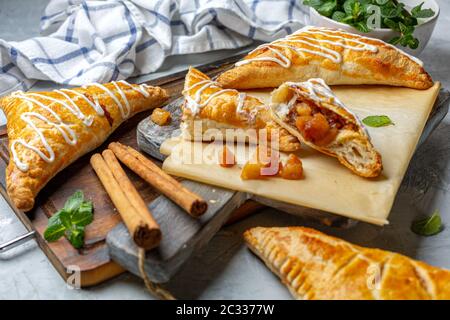 Puff pastry apple pastry turnovers for dessert. Stock Photo