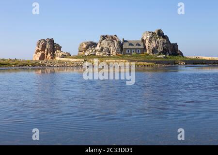 famous house on the rocks at ploumenach, cote de granit rose, cotes d'armor brittany, france Stock Photo