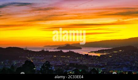 Sunset over the city of Pontevedra, Poio, Ria de Pontevedra and Tambo Island. Stock Photo