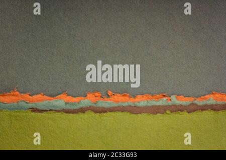 abstract landscape in green, brown and orange tones - a collection of colorful handmade Indian papers produced from recycled cotton fabric Stock Photo