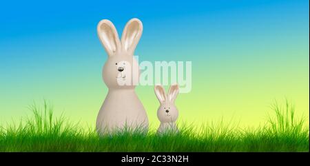 two easter bunnys stand on a meadow with pastel background Stock Photo