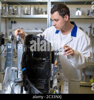 instrument for precise 3D measurement of plastic moldings for the automotive industry. Stock Photo