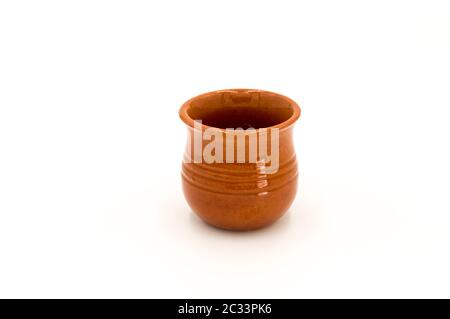 Porcelain puffed ramekin dish in brown color isolated on white background Stock Photo