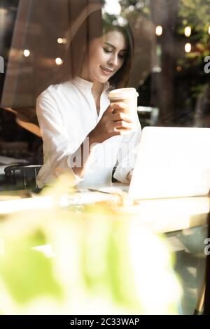 Freelancer woking at cafe Stock Photo