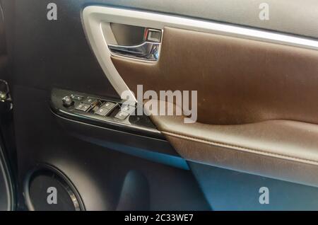 Interior car door panel. Window push button switch Stock Photo