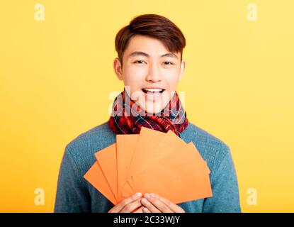 happy asian young man celebrating  chinese new year Stock Photo