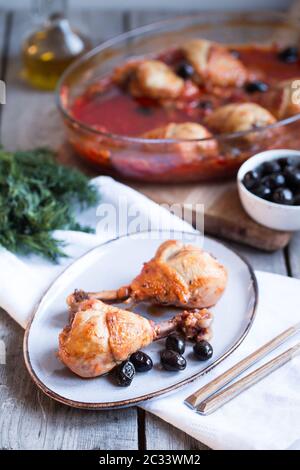 Chicken Cacciatore braised with wine, olives and tomatoes, traditional Italian dish Stock Photo