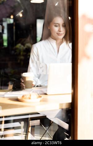 Freelancer woking at cafe Stock Photo
