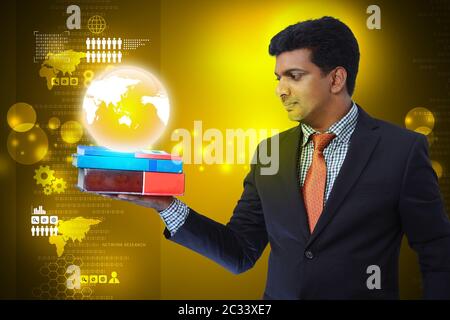 Business man with books and globe Stock Photo