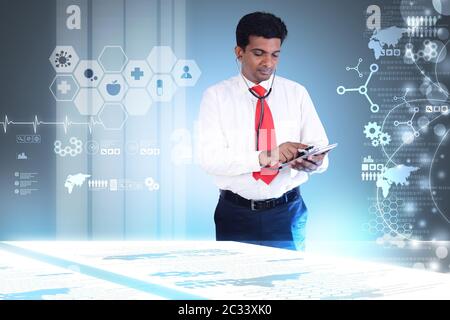 doctor at hospital using a digital tablet Stock Photo
