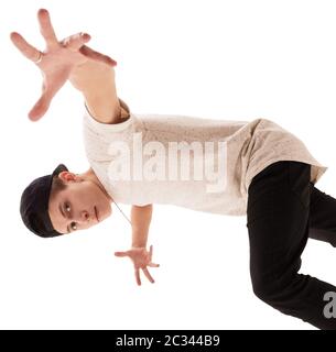 Young handsome rap dancer in baseball cap jumping Stock Photo