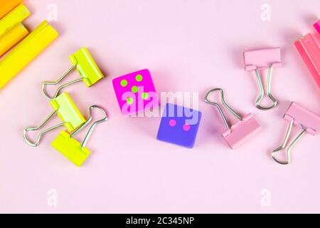 Multi-colored red yellow pinc pencils rulers, pens, pencils and scissors and stationery stand on a pink background. Stock Photo