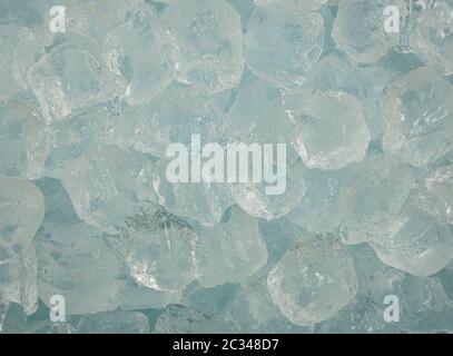 Close up background texture of clear ice cubes and rocks, directly above Stock Photo