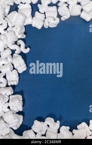 Polystyrene or white styrofoam packing pieces used for minimize bumps in transportation of goods. Stock Photo