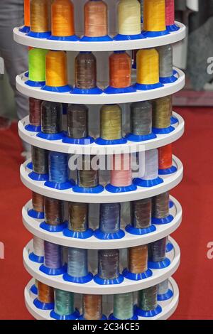 Colorful sewing threads and yarns at bobbins Stock Photo - Alamy