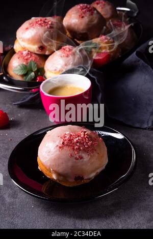 Delicious Berlin donuts filled with raspberry jam Stock Photo