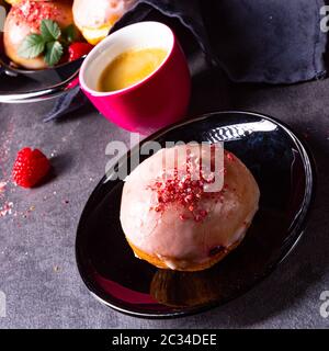 Delicious Berlin donuts filled with raspberry jam Stock Photo