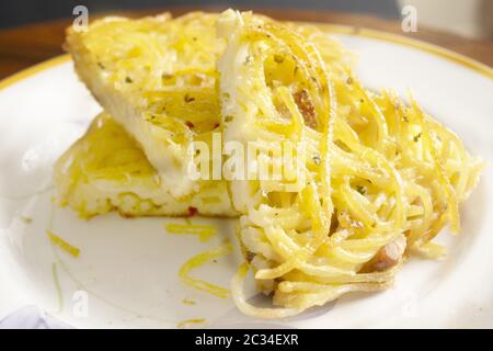 wedge of homemade omelette pasta in a dish