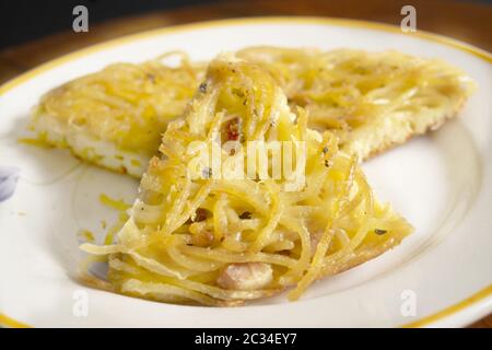 wedge of homemade omelette pasta in a dish