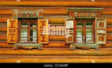 Two vintage wooden windows in russian national style Stock Photo