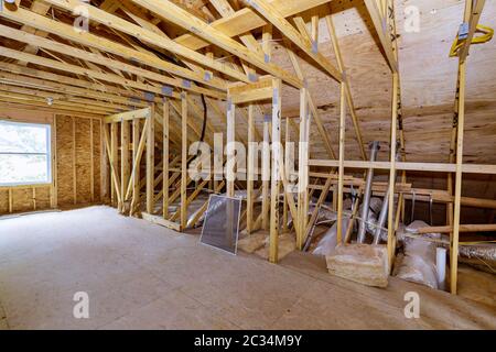House attic under construction interior inside a frame walls beam built framework frame home Stock Photo