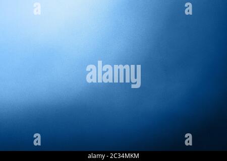 Abstract colorful background with grunge noise grain texture and radial color gradient of dark indigo blue and white from corner Stock Photo