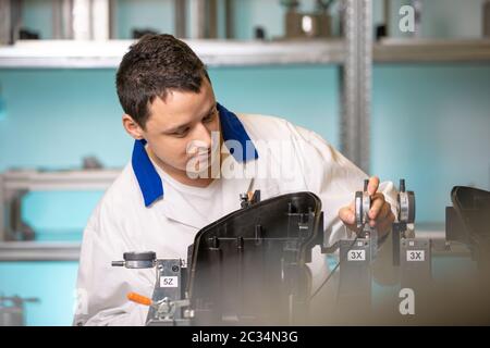 Scientists checking apparatus for accurate 3D measurements in a research laboratory. Stock Photo