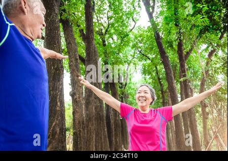 happy asian Senior  couple exercising outdoors Stock Photo