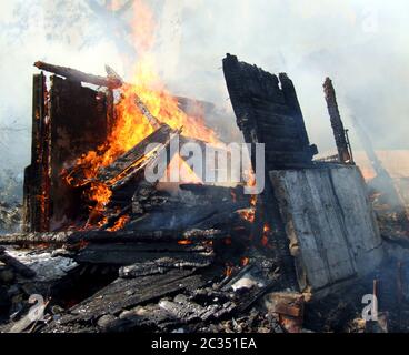 Fire in an abandoned house Stock Photo