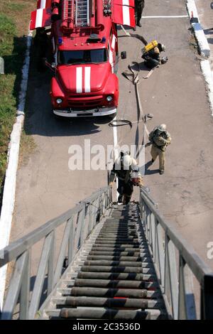 fireman on the stairs Stock Photo