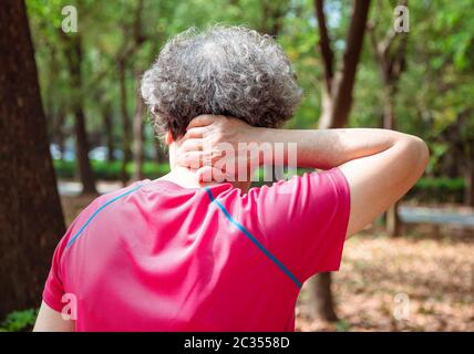 senior  woman having neck pain Stock Photo