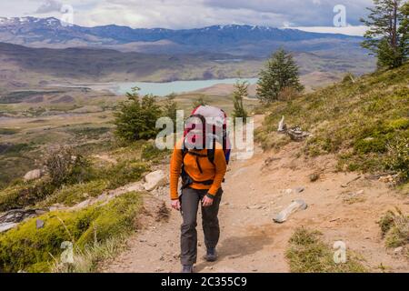 Women trekking in Torres del Paine strong wind blo Stock Photo