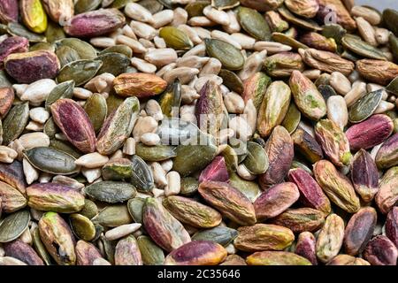 Cashews, pistachio, pumpkin seeds, sunflower seeds in plastic boxes Stock Photo