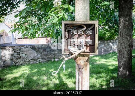 Electricity distribution box. Emergency condition, dangerous. Insulation, rusty and waterproof. City park and public place Stock Photo