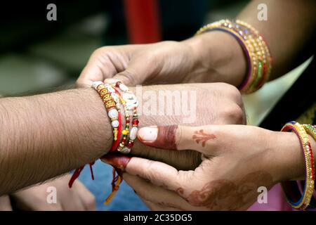 Rakshabandhan, celebrated in India as a festival denoting brother-sister love and relationship. Sister tie Rakhi as symbol of intense love for her bro Stock Photo
