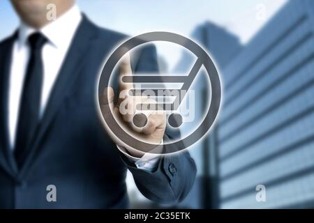 Shopping cart touchscreen is operated by businessman. Stock Photo