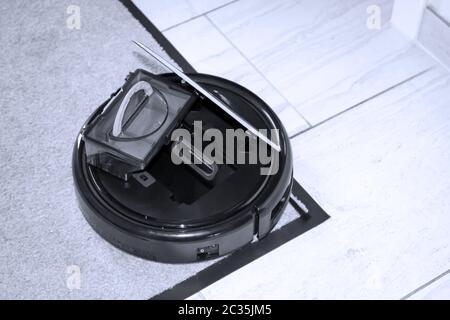 Housekeeping for in between, details of a vacuum robot Stock Photo